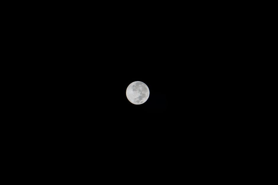 Clear image of a full moon set against a dark night sky, showcasing lunar details.