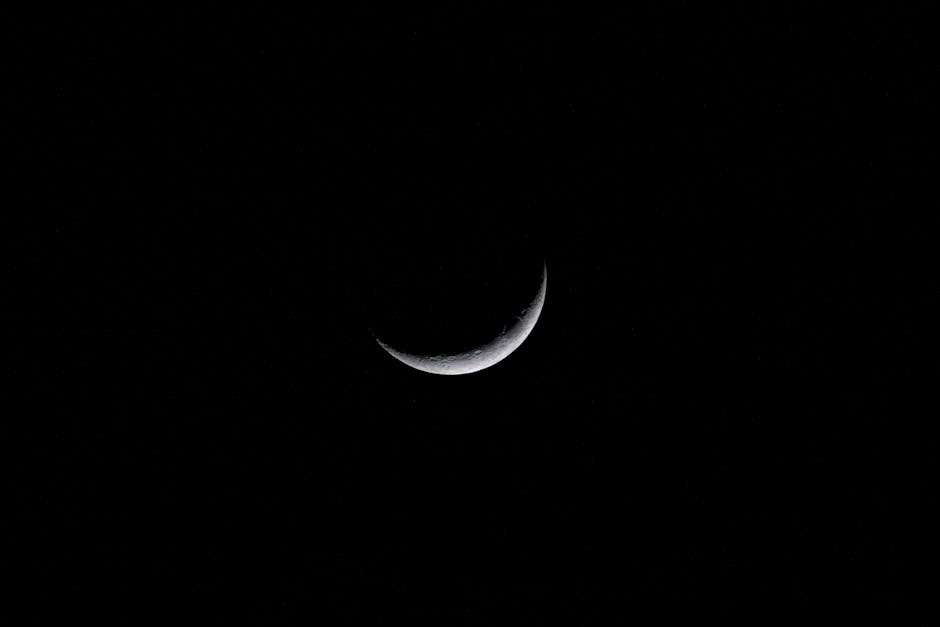 Captivating crescent moon against a dark night sky, perfect for astronomy enthusiasts.