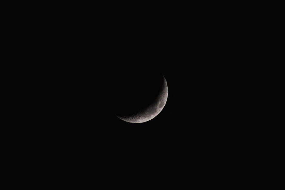 A clear crescent moon captured against a dark night sky, showcasing natural beauty.