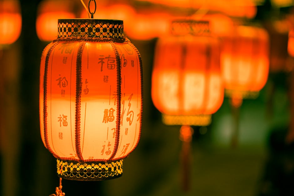 Vibrant red Chinese lanterns glowing warmly, creating a festive atmosphere.