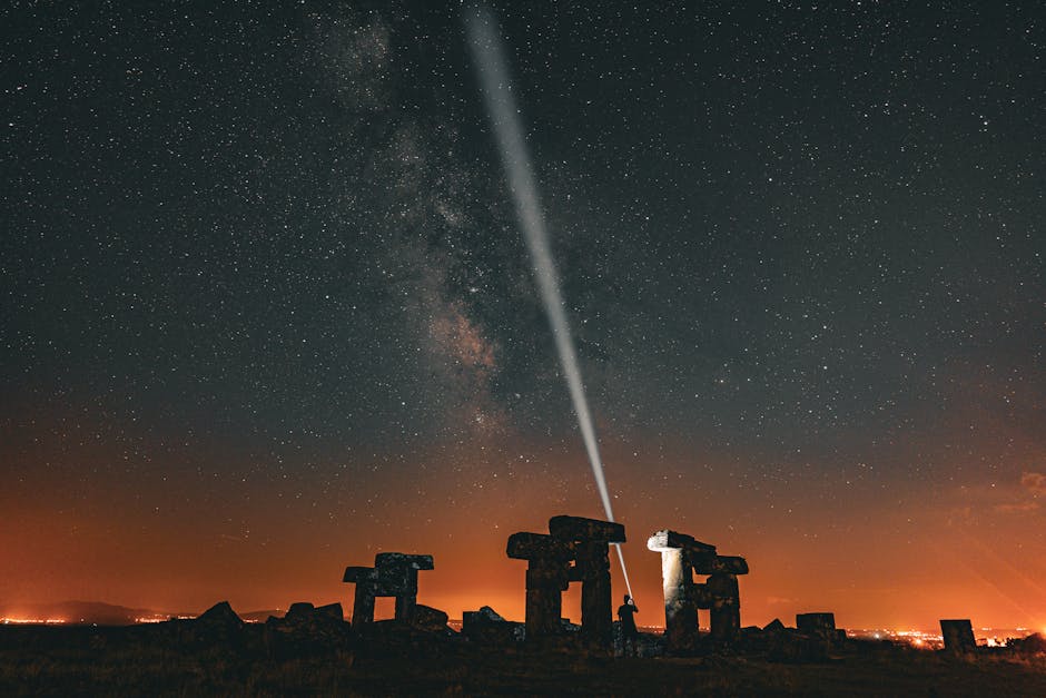 A breathtaking view of the Milky Way illuminating ancient ruins under the starry sky in Ulubey, Türkiye.