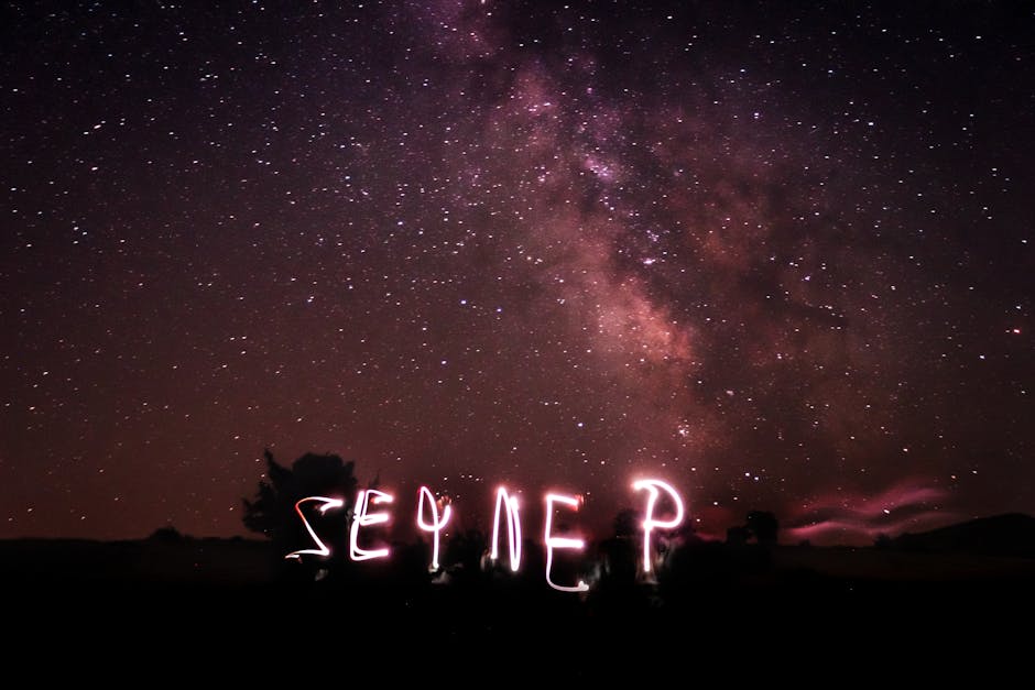 A breathtaking view of the Milky Way with creative light painting in a clear night sky.