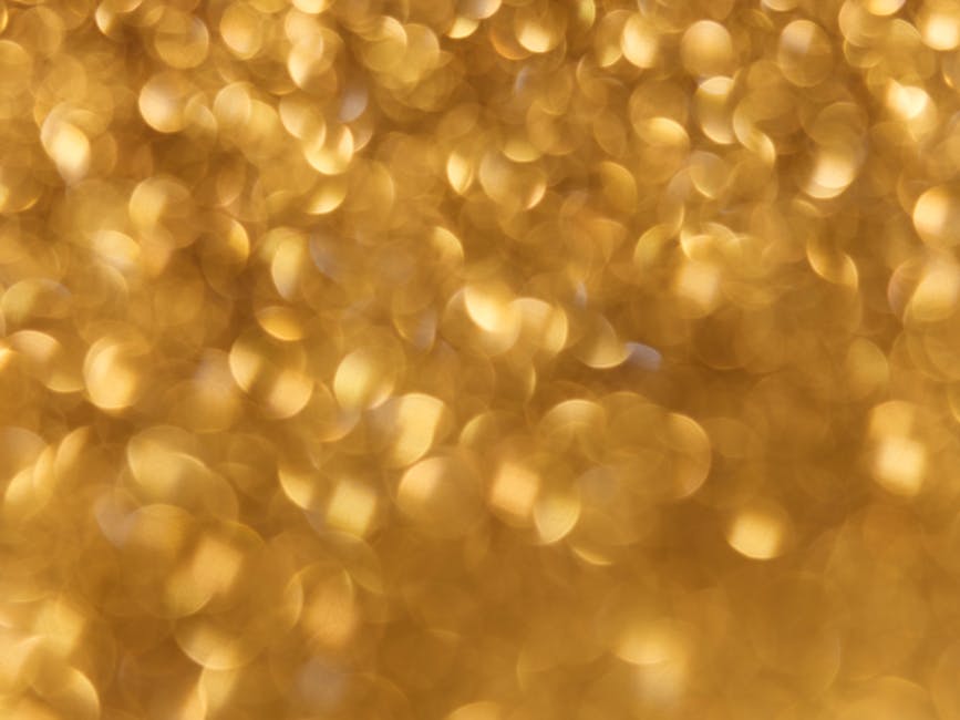Abstract golden bokeh background perfect for holiday and festive designs.