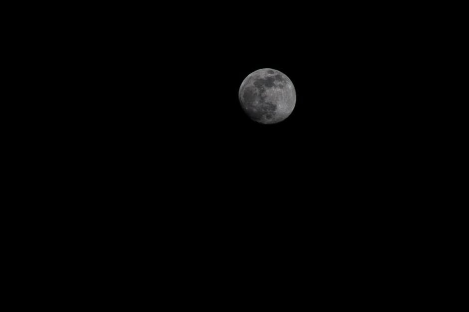Captivating image of the full moon shining brightly against a dark night sky in California.