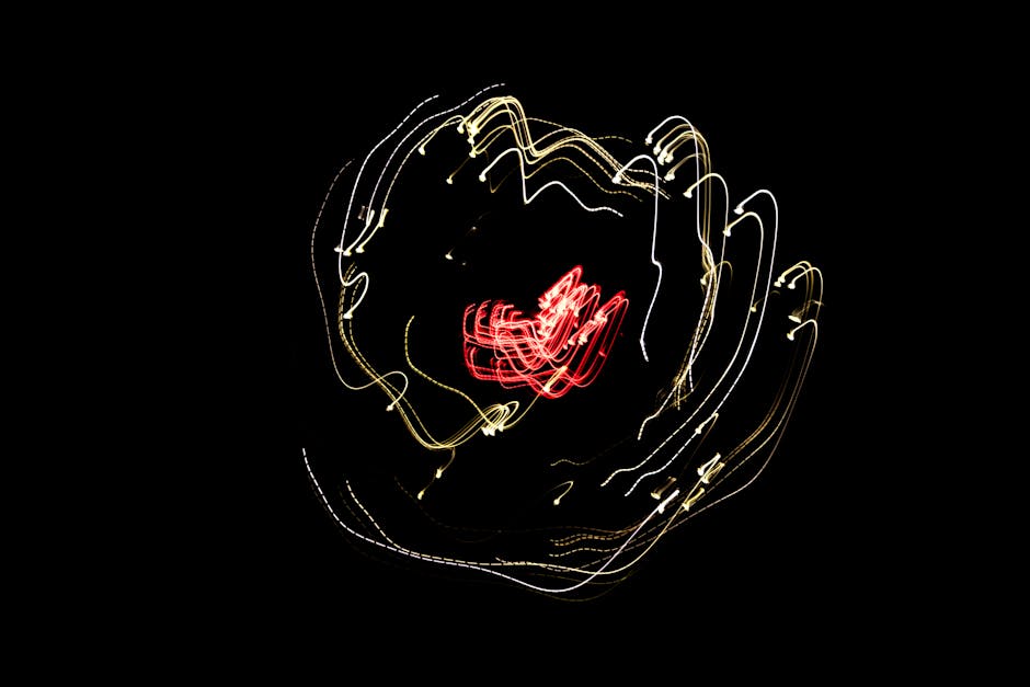 Abstract light trails forming dynamic patterns against a dark background.