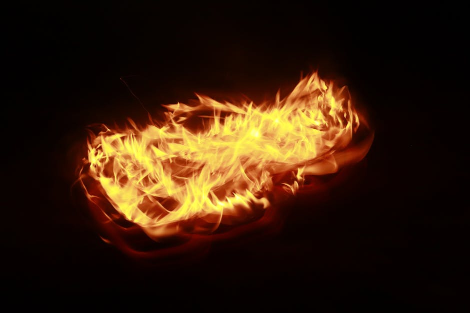 Abstract display of vivid flames motion-captured against a dark backdrop, highlighting fiery dynamics.