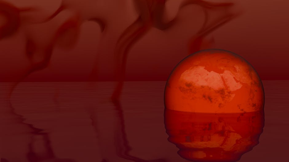 Abstract red sphere on a reflective surface emits a moody and mysterious ambiance.