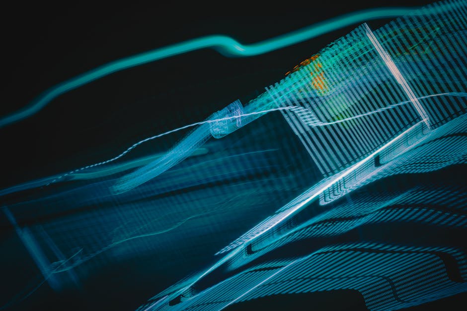 Abstract digital artwork with blue light streaks on a dark background, creating a futuristic feel.