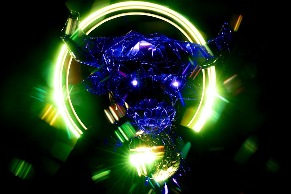 A striking abstract bull sculpture illuminated by neon green and blue lights.