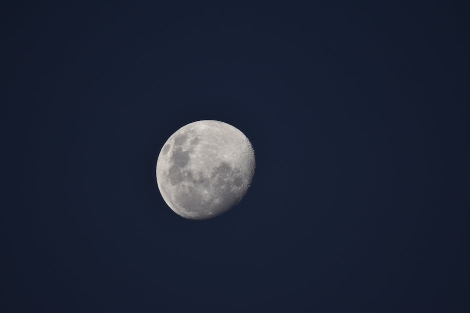 Capture of a waning gibbous moon against a deep night sky, showcasing intricate lunar details.