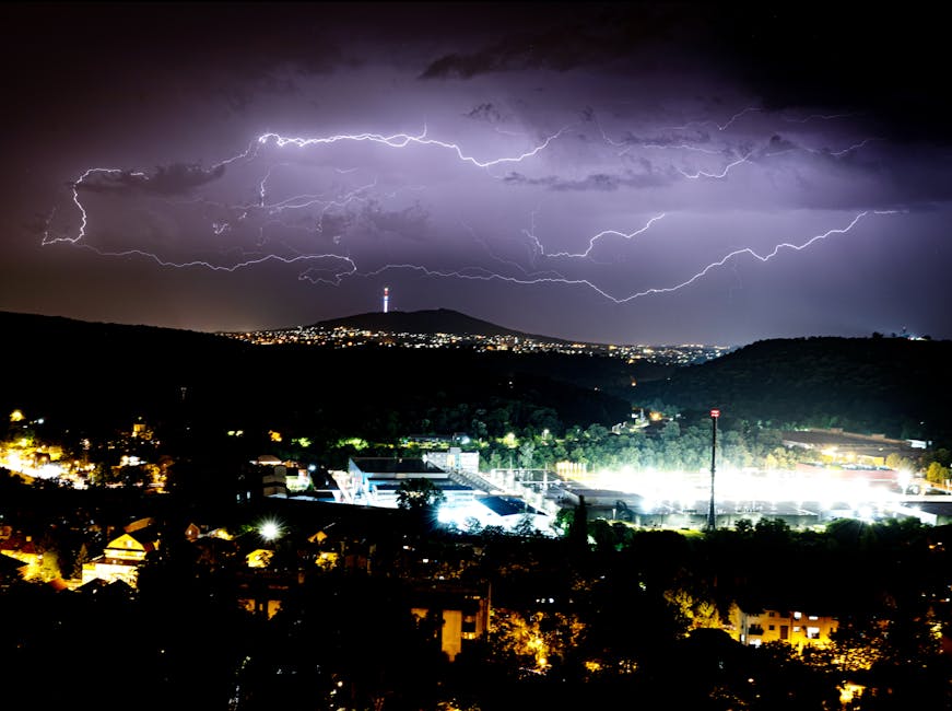 A dramatic thunderstorm illuminates the night sky over a vibrant cityscape, capturing nature's raw power.