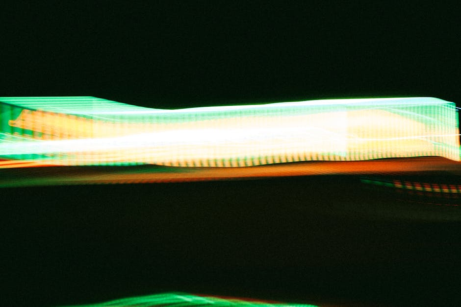 Vibrant abstract pattern of neon light trails creating dynamic energy.