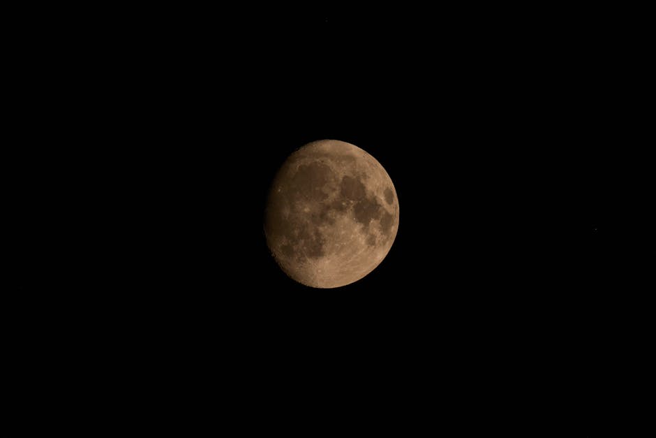 A breathtaking image of the waning gibbous moon against a black sky, capturing its detailed surface.