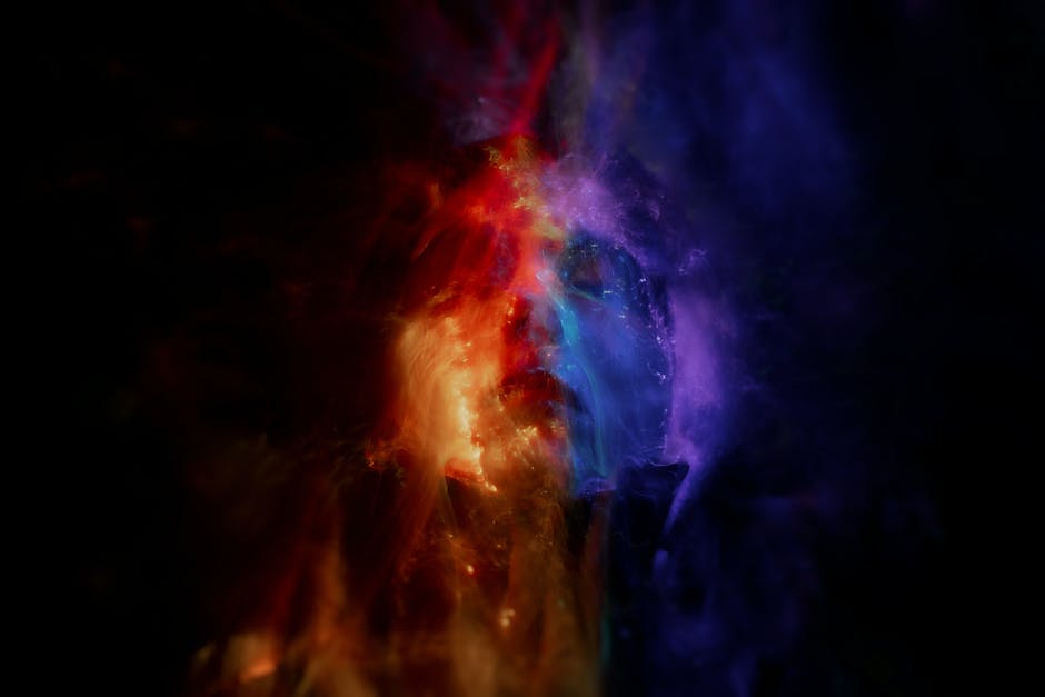 Abstract vibrant image featuring glowing red, orange, and blue light waves, creating a dynamic and conceptual design.