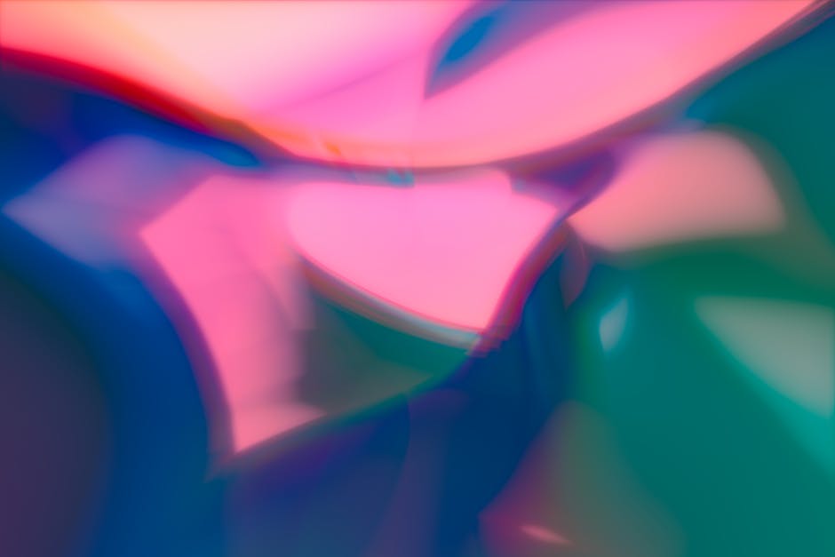 Vibrant abstract image with smooth pastel color transitions and blurred shapes.