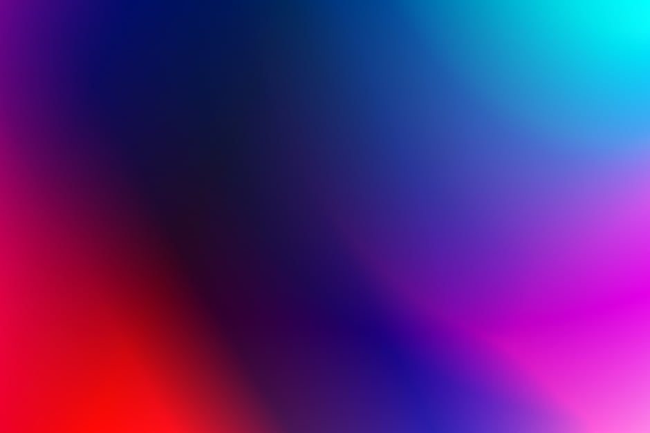 A vivid abstract gradient background with a blend of blue, red, and purple hues.