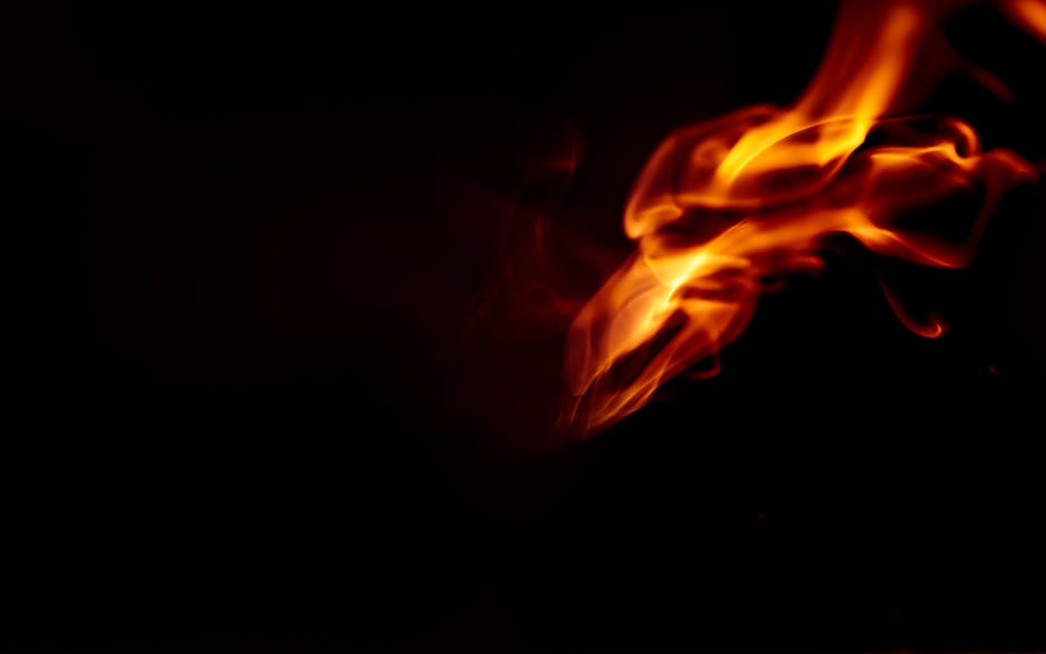 Bright abstract flames against a dark backdrop, perfect for artistic use.