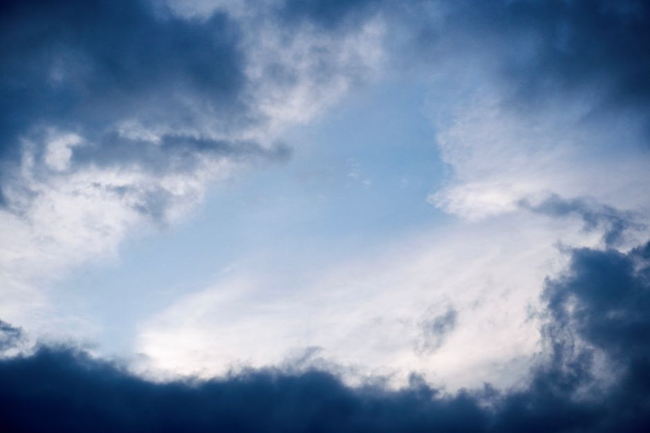 A dramatic cloudy sky in Hyderabad, capturing a moment of contrast between dark and light clouds.