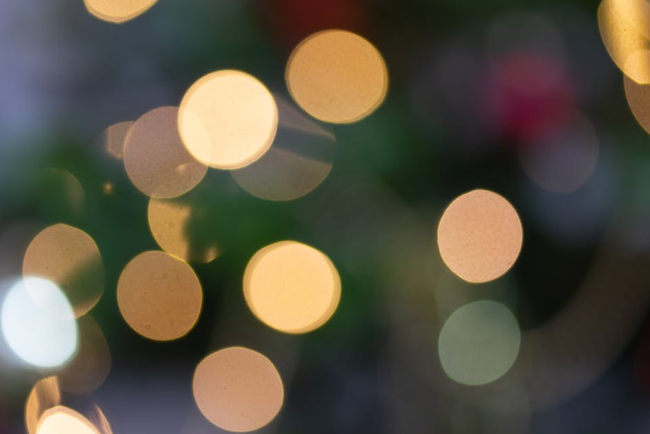 A vibrant bokeh effect with blurred Christmas lights creating a festive abstract background.