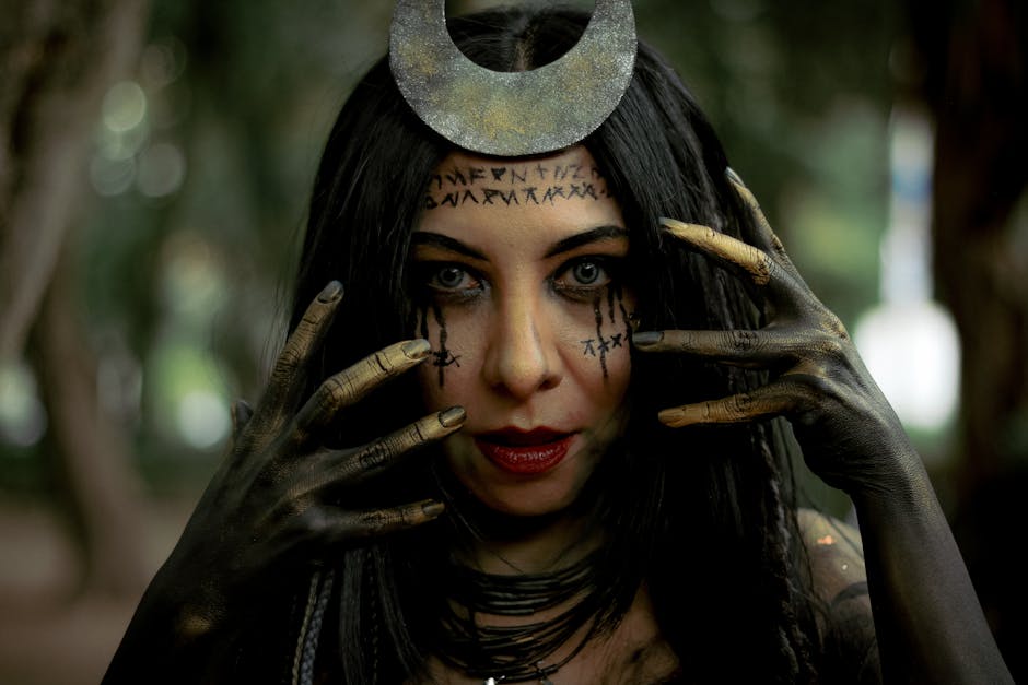 Captivating portrait of a woman with runes and crescent moon headpiece in dark forest.