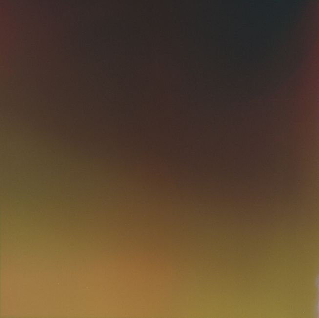 A vibrant abstract background with a smooth gradient of dark and light colors.