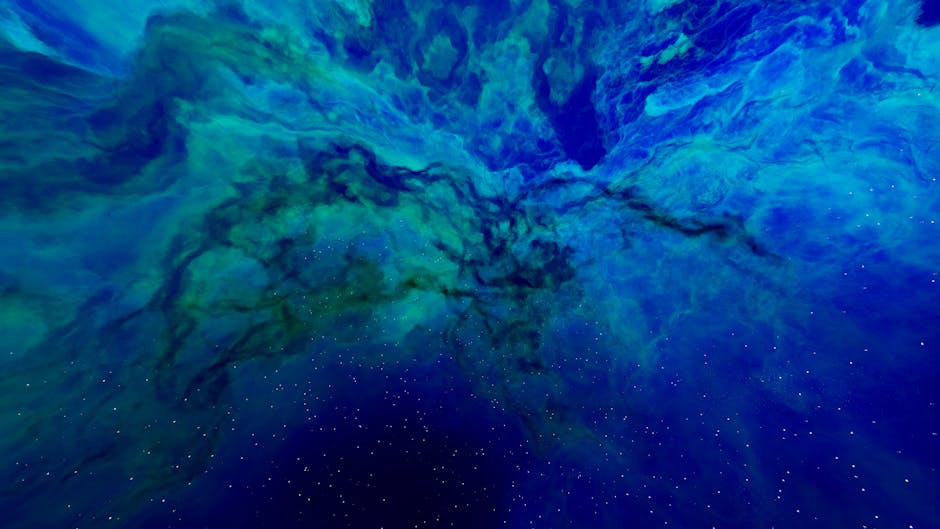 Stunning abstract view of a blue and green nebula with twinkling stars.