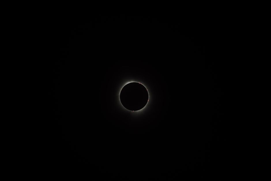 A breathtaking view of a solar eclipse surrounded by darkness, showcasing the beauty of the night sky.