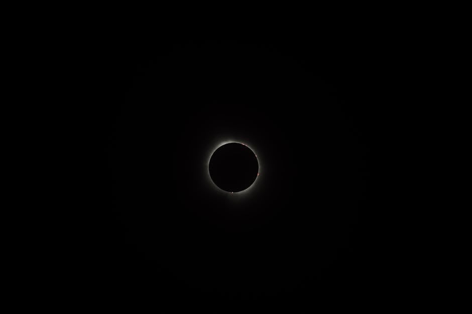 A breathtaking view of a solar eclipse surrounded by darkness, showcasing the beauty of the night sky.