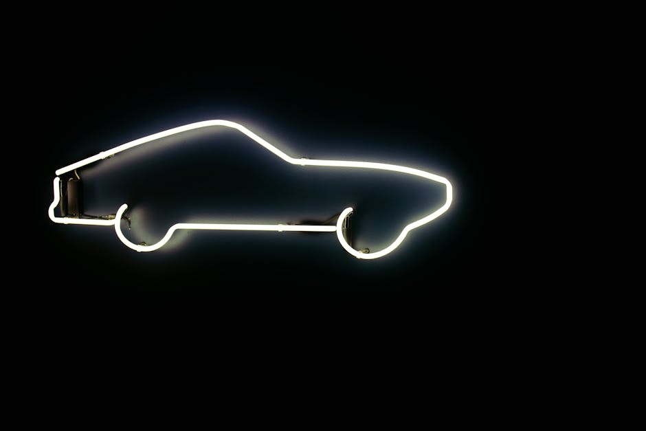 Stylish neon car outline glowing against a dark backdrop, perfect for modern artistic design.