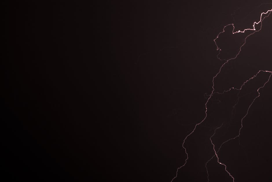 Captivating view of a lightning bolt illuminating the night sky during a thunderstorm.