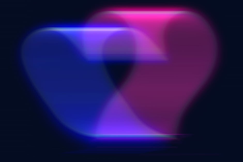 A colorful abstract heart shape in vibrant neon colors with a blurred motion effect.
