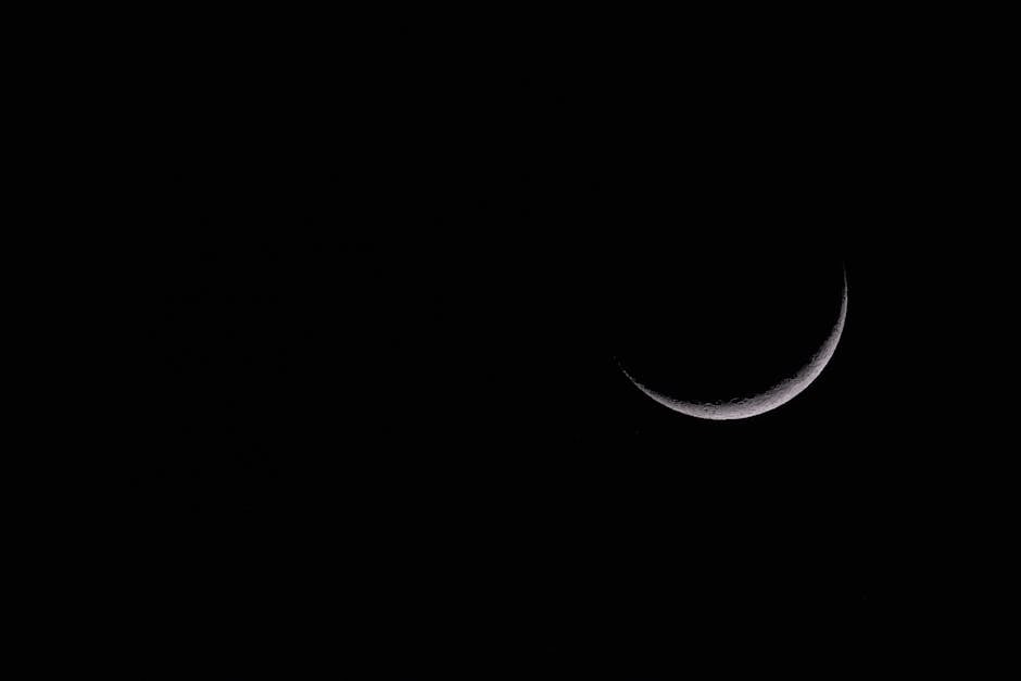 Captivating crescent moon set against a black night sky, showcasing celestial beauty.