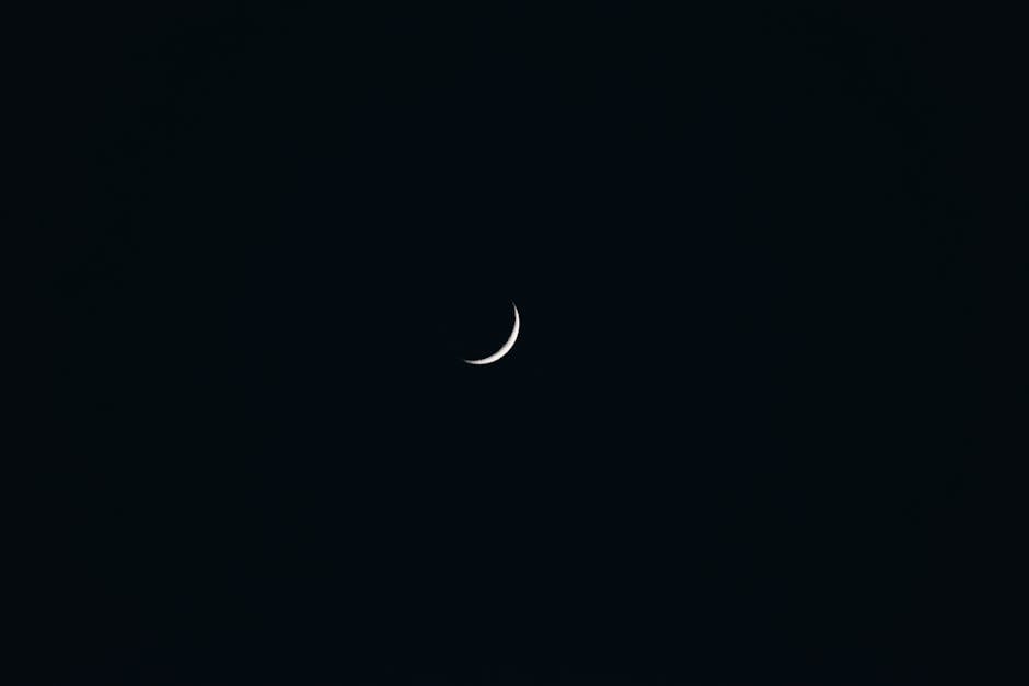 A captivating crescent moon against a dark sky, showcasing minimalist celestial beauty.