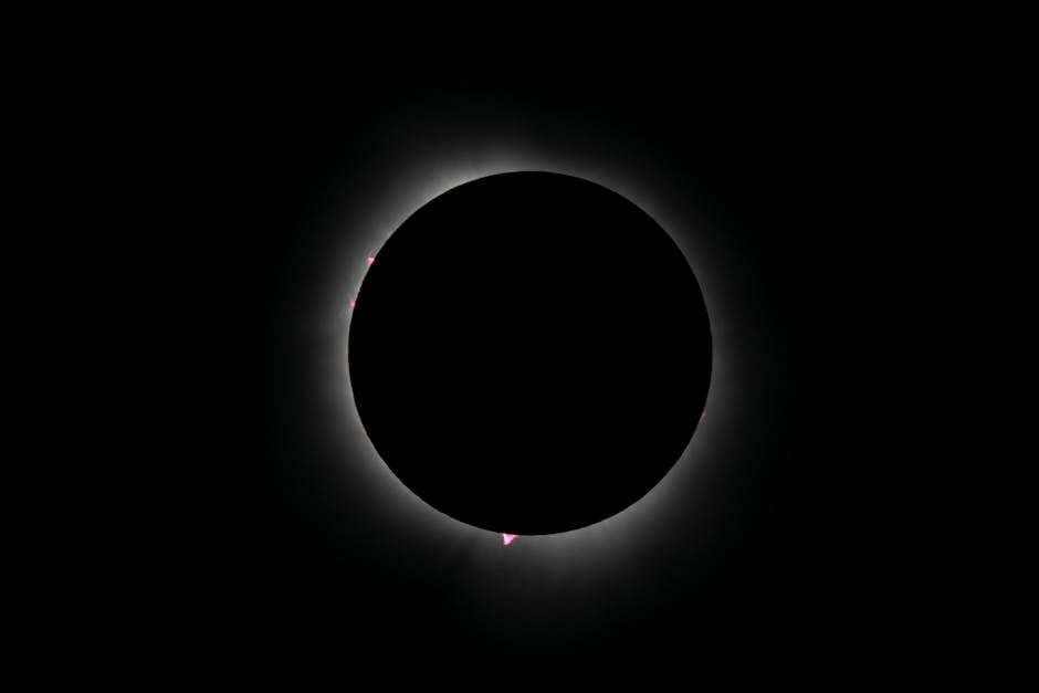 Capture of an annular solar eclipse with glowing corona, showcasing celestial beauty in a dark sky.