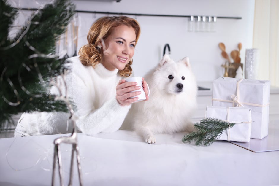 Woman holding a mug with gifts and fluffy dog. Cozy winter scene indoors.